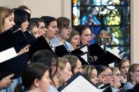 Closeup of chorale performing in the church